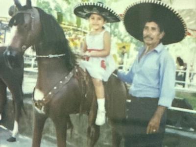 Author on horseback next to her grandfather 